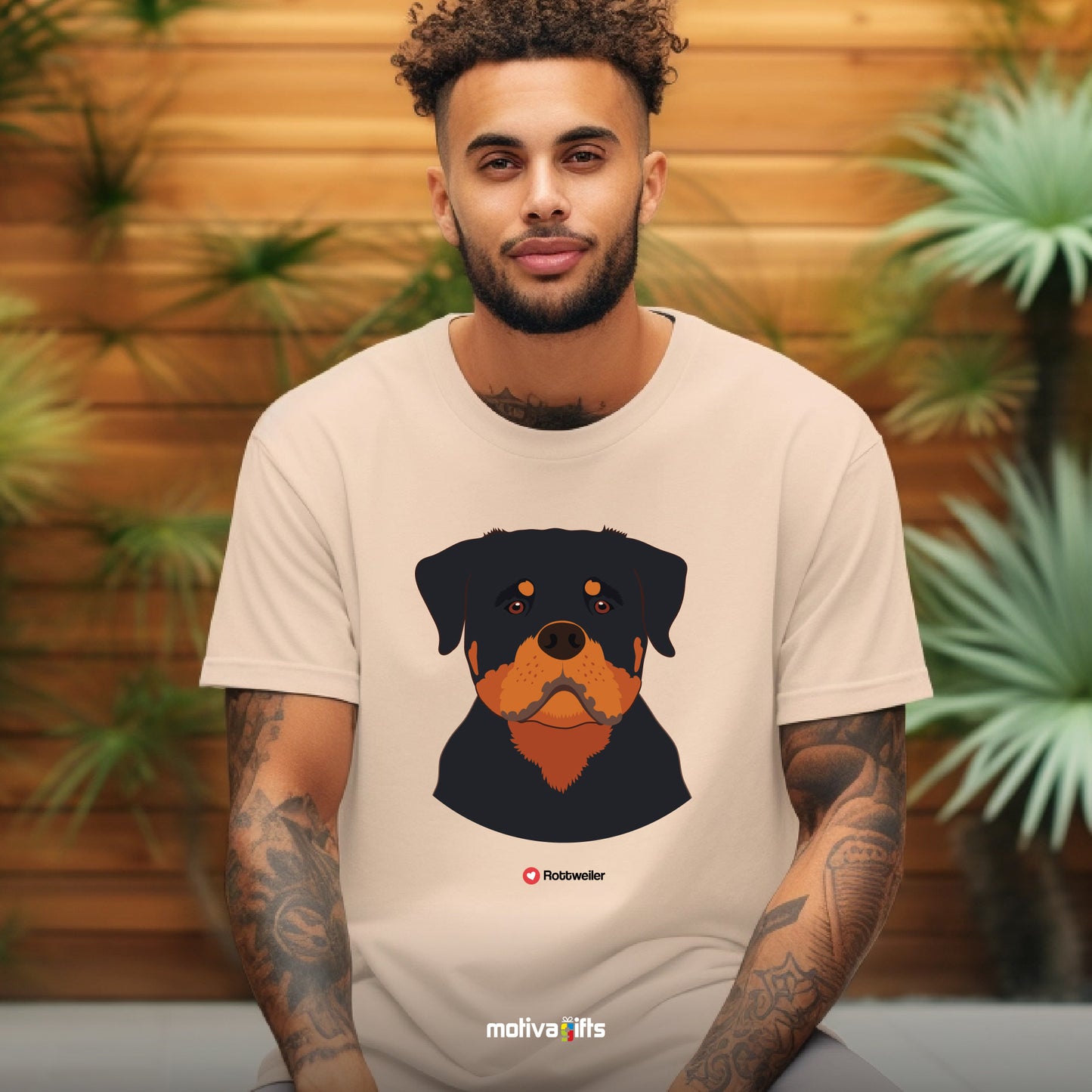 Man wearing sand tshirt with Rottweiler design on the front, front view, by Motiva Gifts.