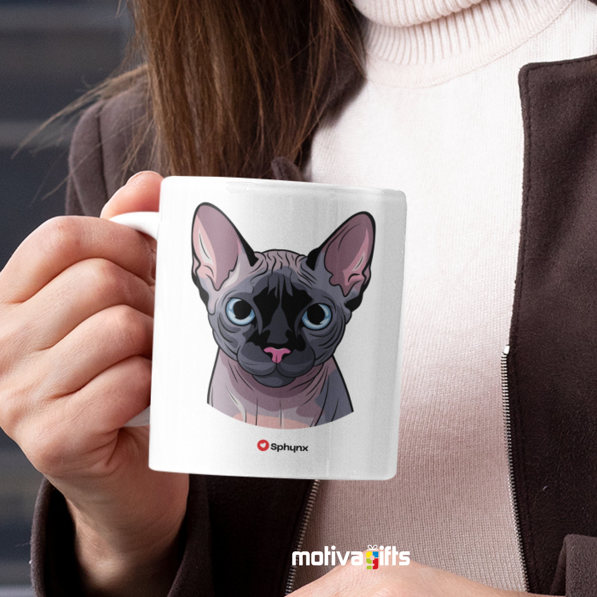 A woman holding a white 11oz ceramic mug featuring Sphynx cat love art printed on both sides
