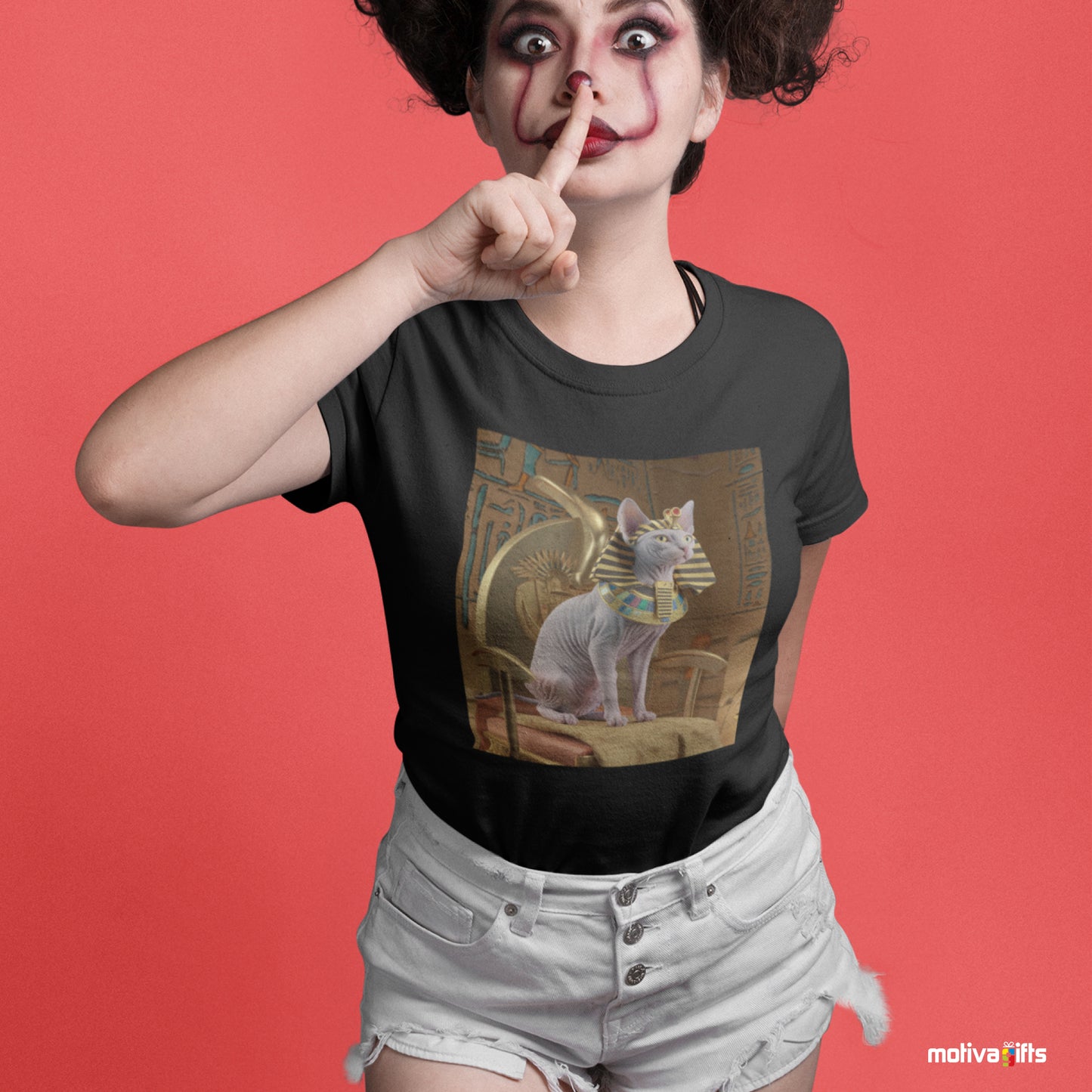 Woman wearing a black Shirt featuring a design of a Sphynx Cat wearing a Pharaoh Halloween costume 