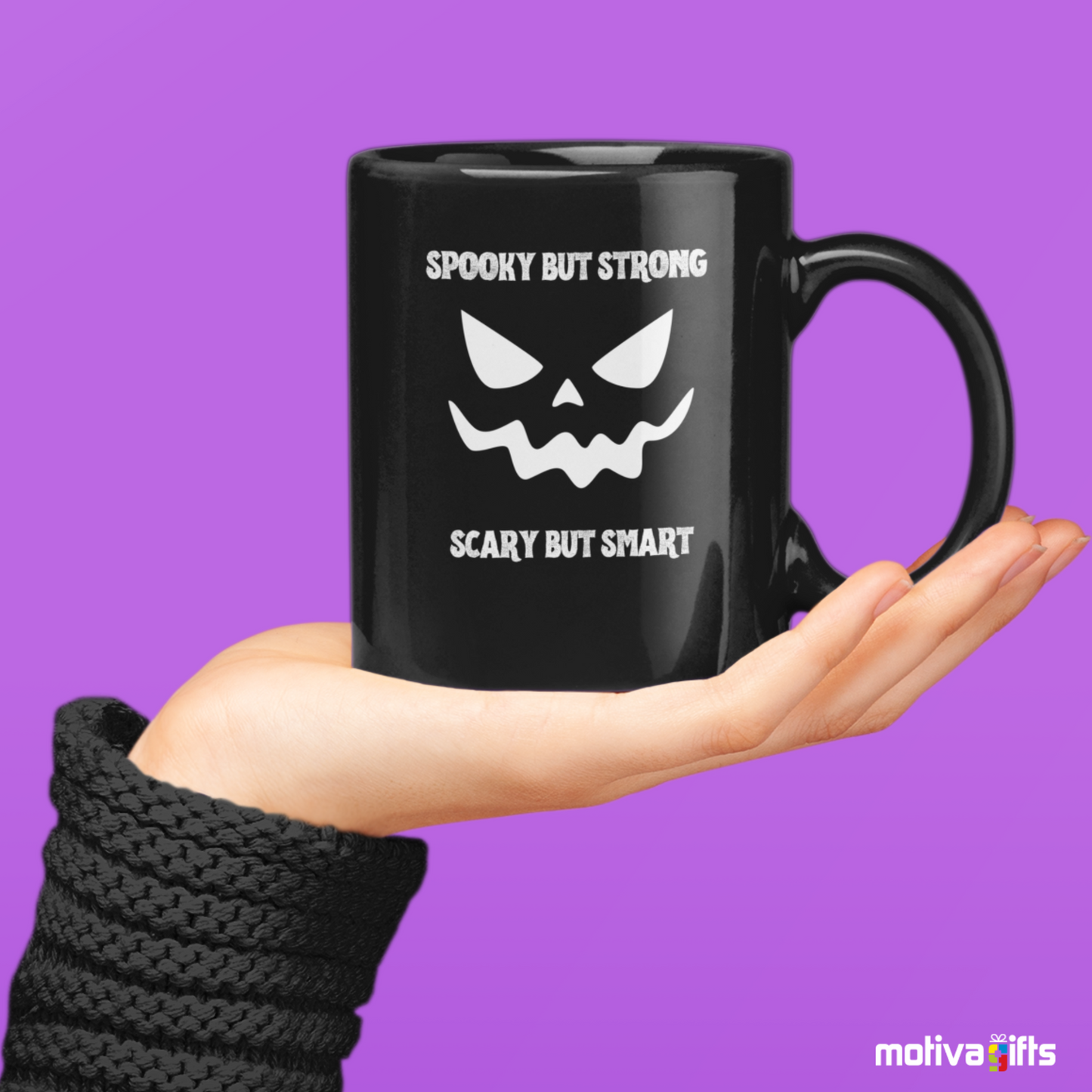 Woman holding a Spooky But Strong, Scary But Smart Mug,Black,11 oz, Motiva Gifts