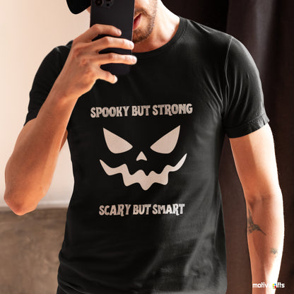 Men wearing a Spooky But Strong, Scary But Smart Unisex black Tshirt