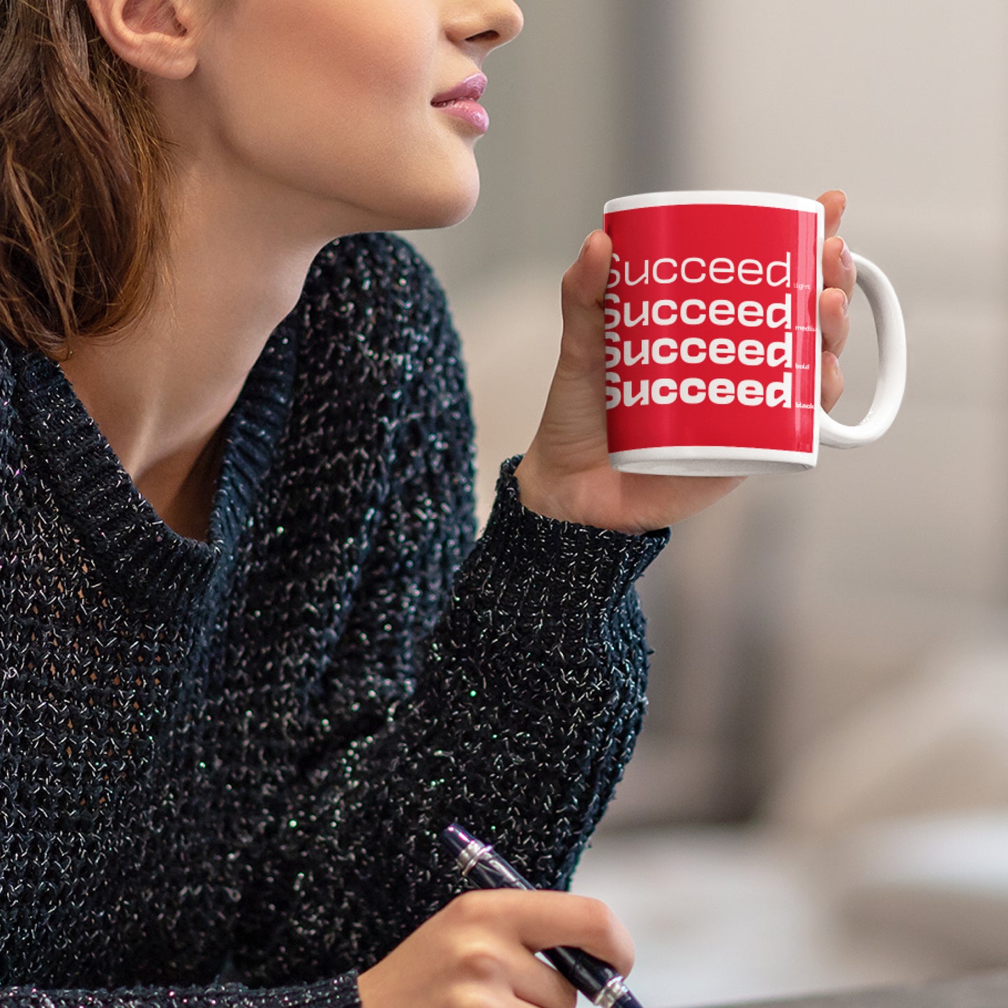 Woman holding a 'Succeed' Wraparound 11 oz Ceramic Mug from Motivate Words Collection, perfect for coffee lovers and dreamers