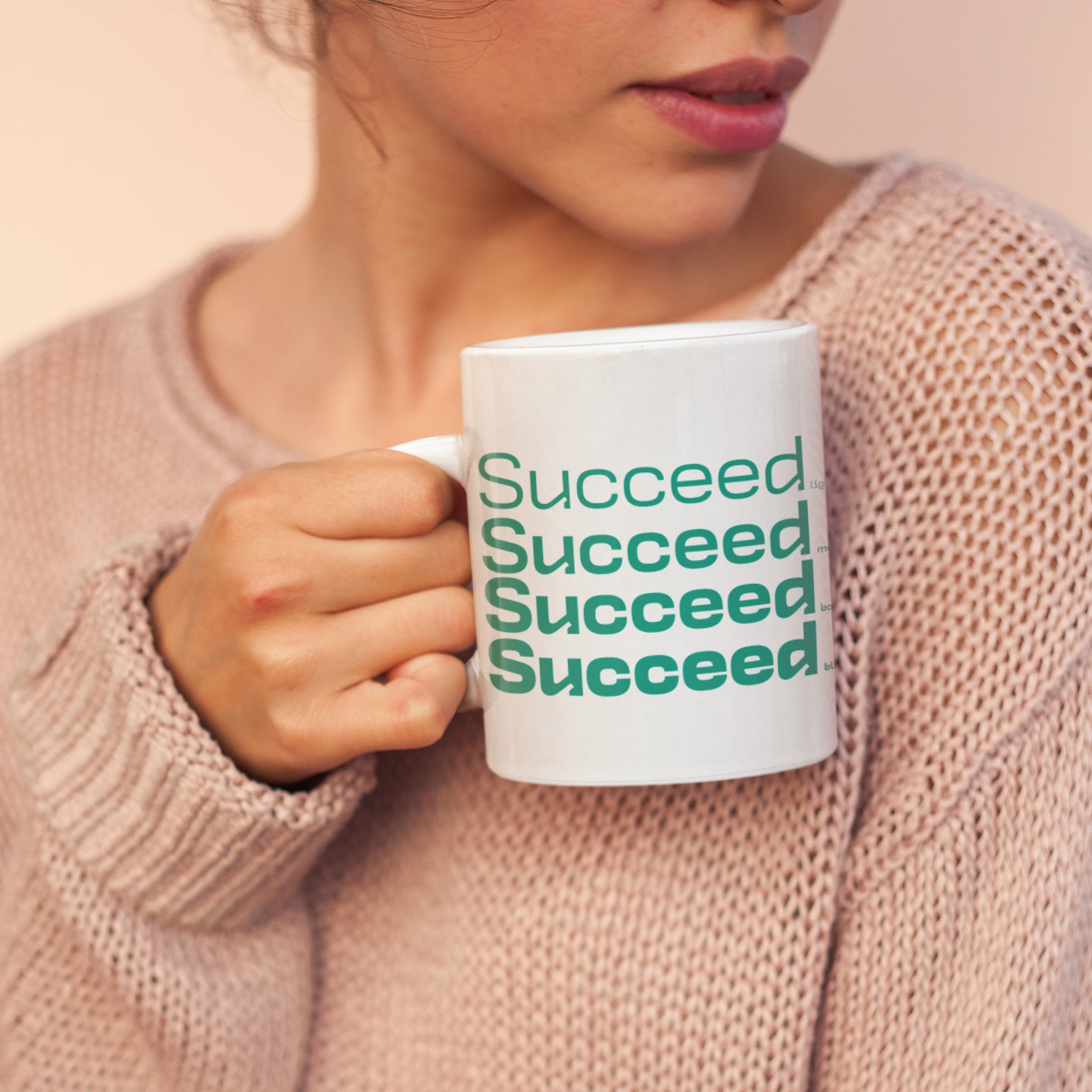 Woman holding a Succeed wraparound 11 oz Ceramic Mug from Motivate Words Collection, perfect for coffee lovers and dreamers.