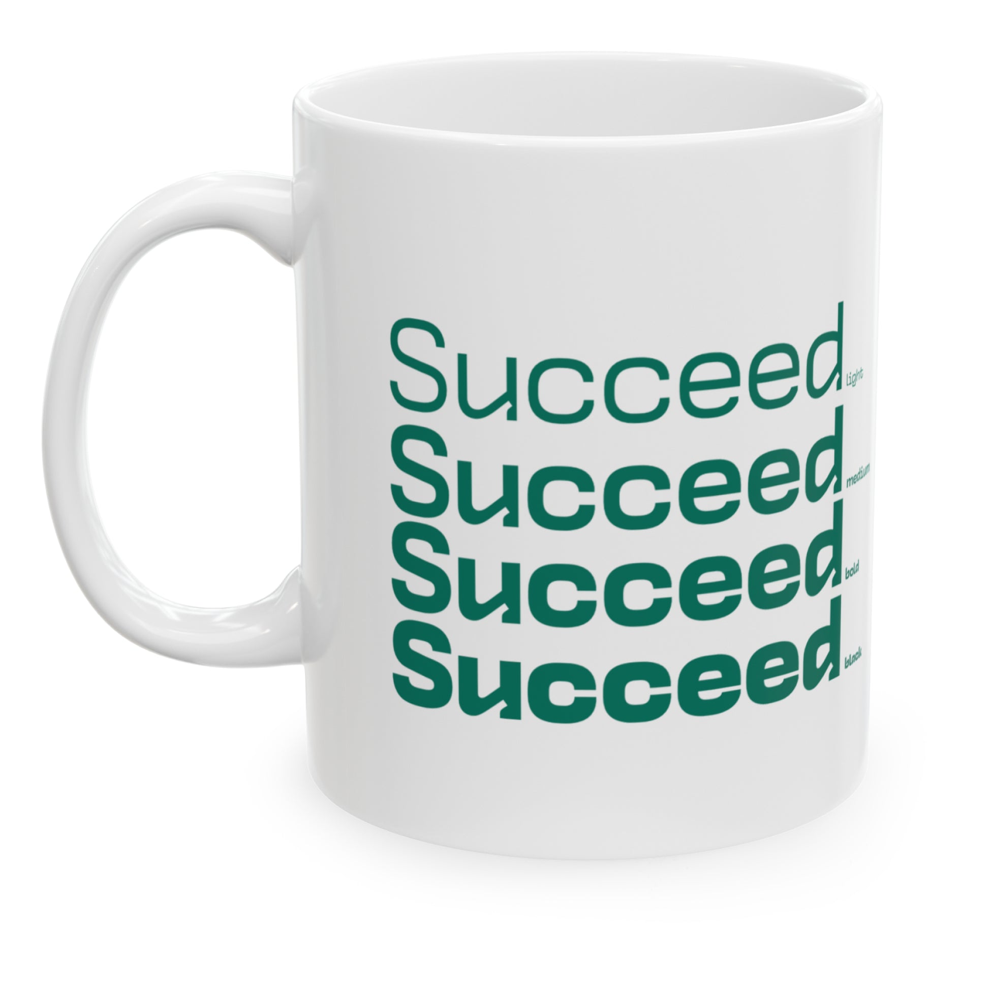 White ceramic mug with a white wraparound design and the word 'Succeed' printed in green in four typography styles: light, medium, bold, and black. Clean white background