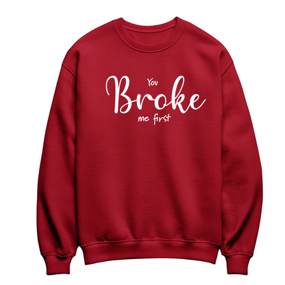 Red flat-lay Unisex Crewneck Sweatshirt featuring white typography that reads You Broke Me First 