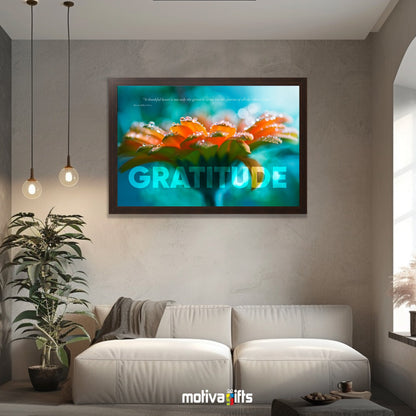 A walnut framed art wall with the word GRATITUDE in large text and a Cicero quote hangs in a modern living room. 